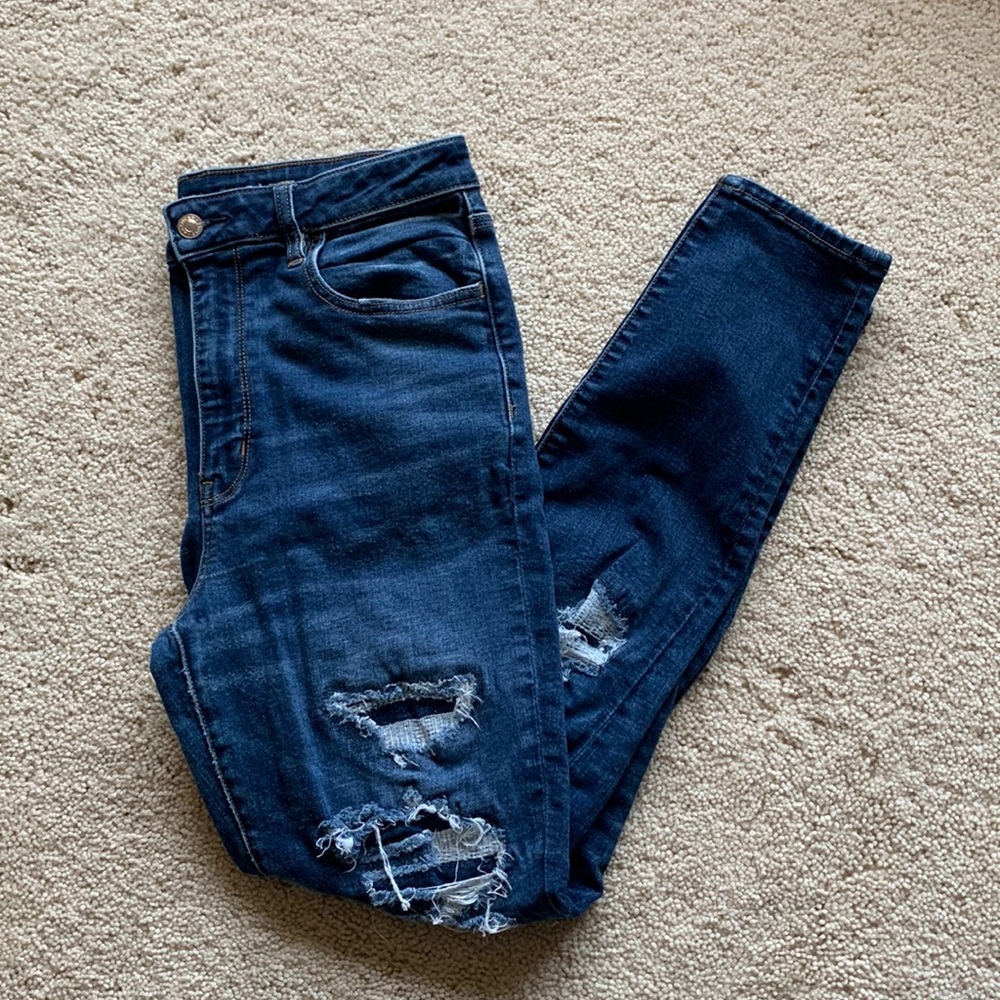 American Eagle Outfitters super stretch denim jeans ripped and has patches